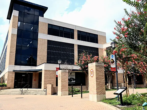 Modern university building with landscaping.