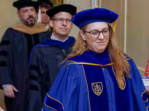 Dr. Elizabeth L’Arrivée at the graduation procession.